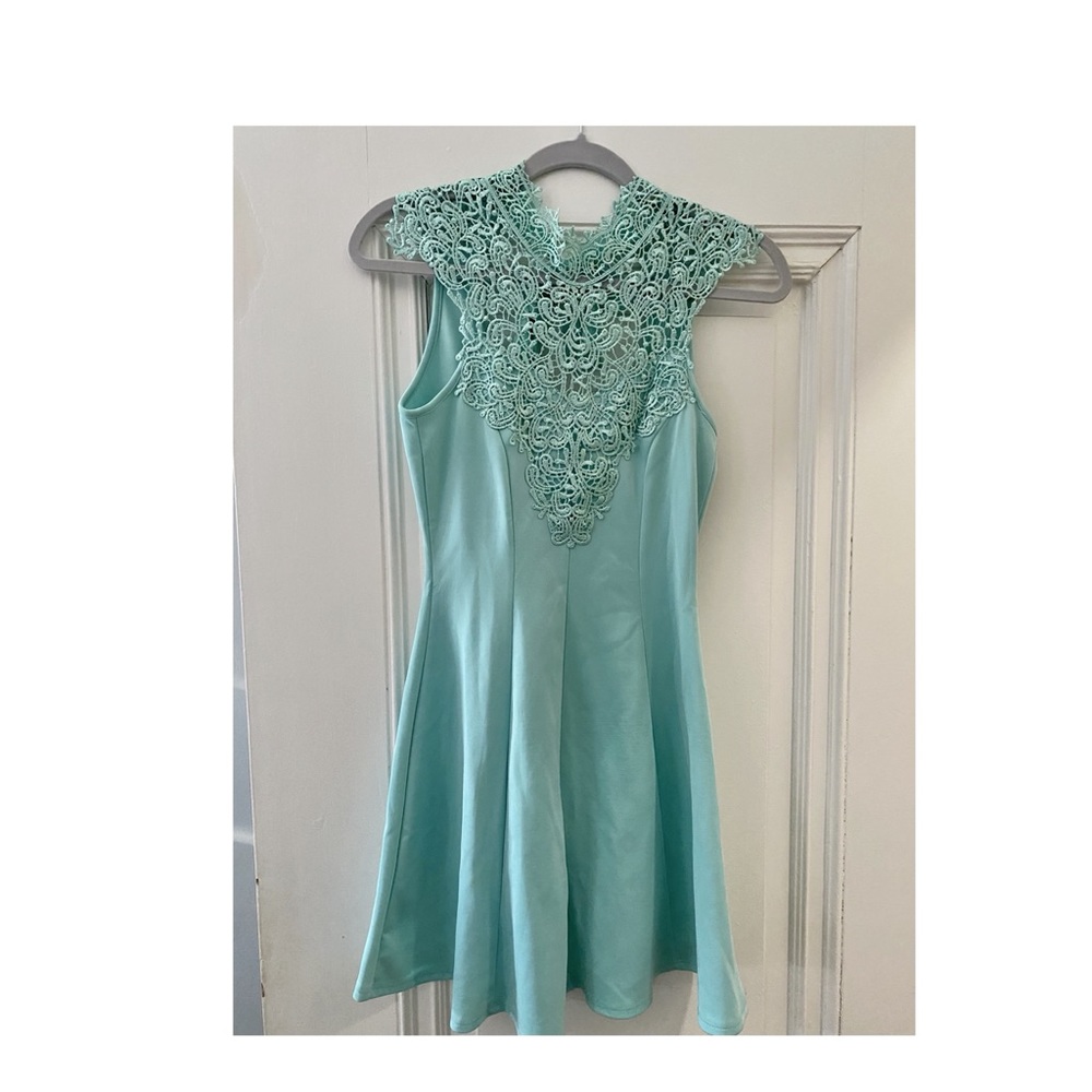 Sea foam green dress with detailed neckline